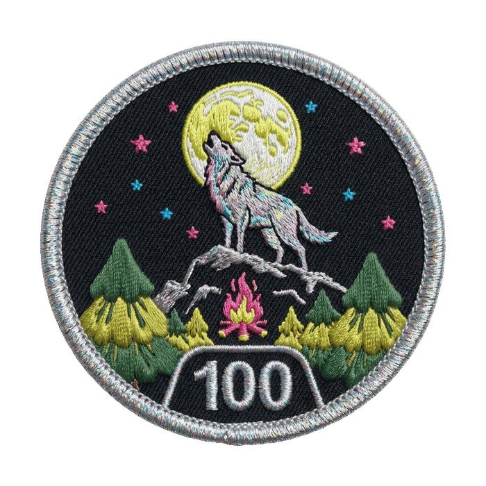 Nature sticker — a wolf howling at the moon by a campfire, tier 100