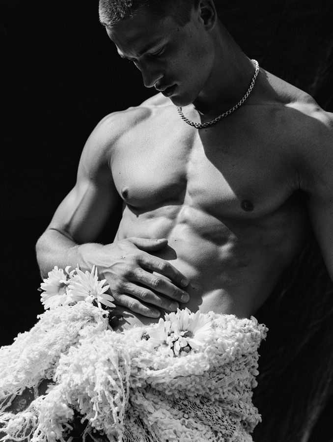 A man holding a towel, in black and white