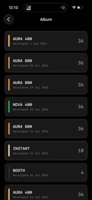SLOSTA album screen — a list of developed rolls (AURA 400, AURA 800, NOVA 400, INSTANT, BOOTH) each with its frame count and develop date